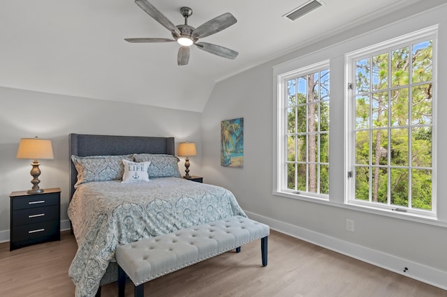1510 Match Point Ln Unit 303, Panama City Beach, FL 32413 - bedroom featuring wood finished floors, vaulted ceiling, ceiling fan, and crown molding
