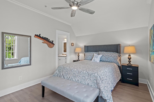1510 Match Point Ln Unit 303, Panama City Beach, FL 32413 - bedroom with wood finished floors, vaulted ceiling, ornamental molding, ensuite bathroom, and ceiling fan