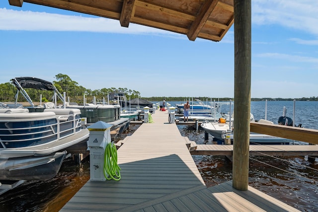 1510 Match Point Ln Unit 303, Panama City Beach, FL 32413 - dock area featuring boat lift and a water view