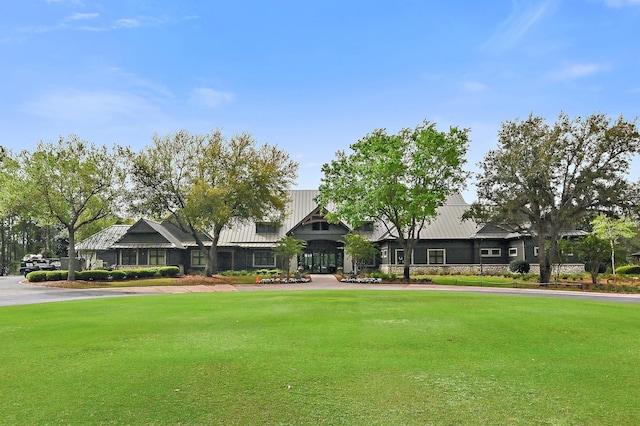 1510 Match Point Ln Unit 303, Panama City Beach, FL 32413 - view of front of house featuring a front lawn and stone siding