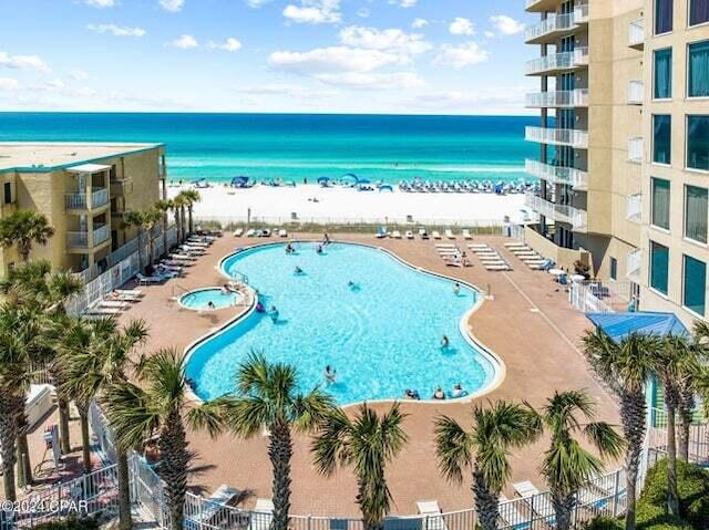 11483 Front Beach Rd Unit 1004, Panama City Beach, FL 32407 - view of swimming pool featuring a water view