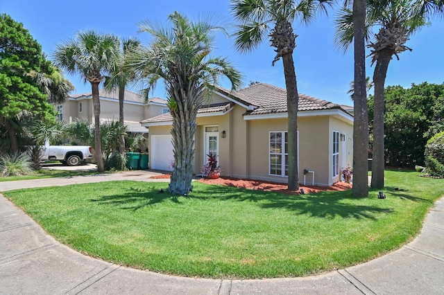113 Mantero Way, Destin, FL 32541 - view of front of property featuring a garage, stucco siding, concrete driveway, and a front lawn