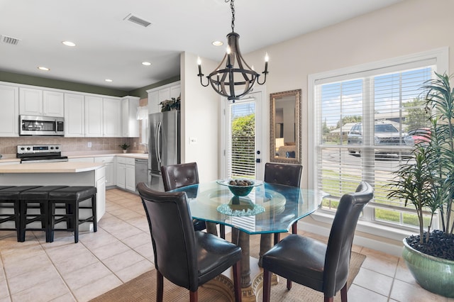 113 Mantero Way, Destin, FL 32541 - dining area featuring a chandelier, light tile patterned floors, and recessed lighting