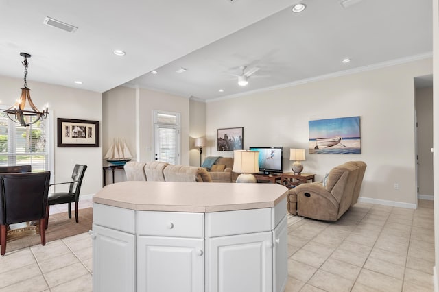113 Mantero Way, Destin, FL 32541 - kitchen with light tile patterned floors, open floor plan, crown molding, a chandelier, and light countertops