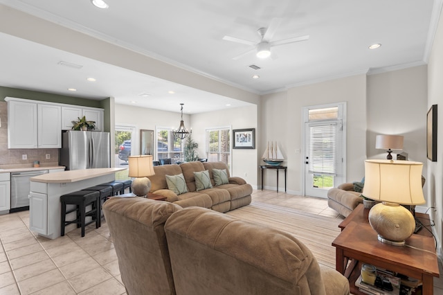 113 Mantero Way, Destin, FL 32541 - living room with light tile patterned floors, ceiling fan, crown molding, recessed lighting, and a chandelier