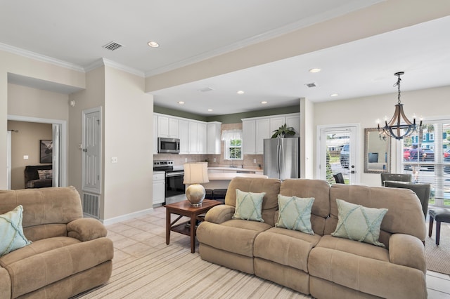 113 Mantero Way, Destin, FL 32541 - living room with a chandelier, healthy amount of natural light, recessed lighting, light tile patterned floors, and crown molding