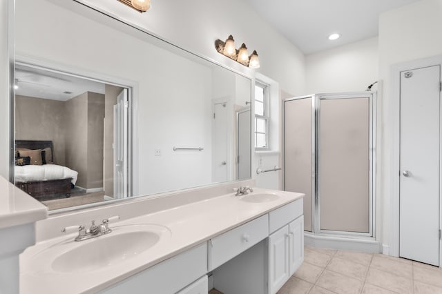 113 Mantero Way, Destin, FL 32541 - ensuite bathroom featuring double vanity, a stall shower, and tile patterned floors