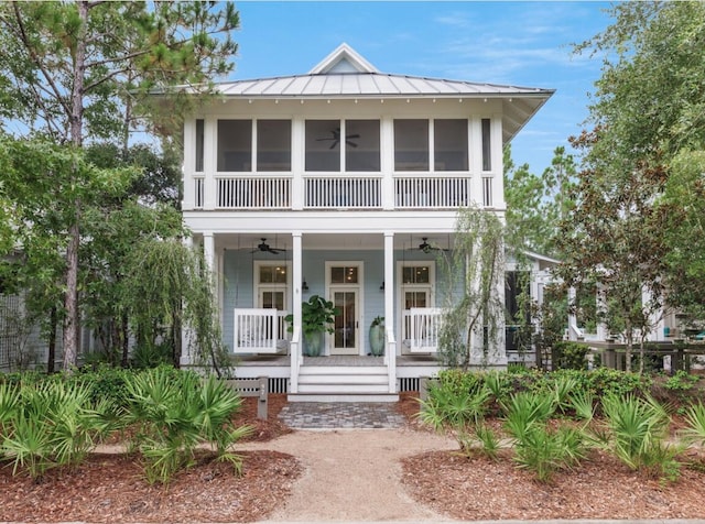 97 Red Cedar Way, Santa Rosa Beach, FL 32459 - view of front facade featuring ceiling fan, covered porch, a standing seam roof, and a metal roof