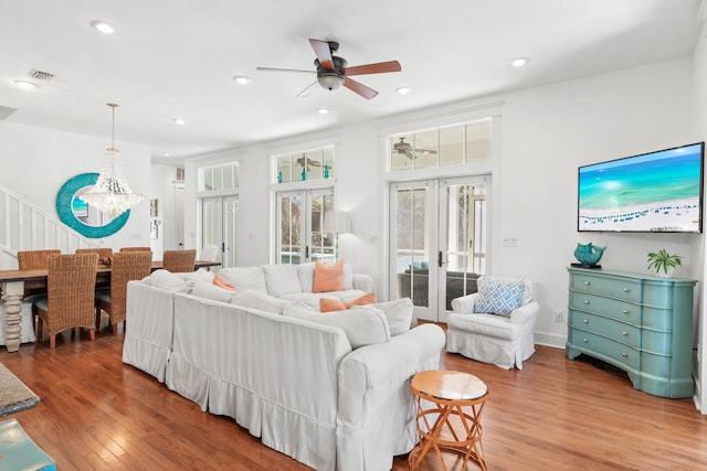 97 Red Cedar Way, Santa Rosa Beach, FL 32459 - living room featuring ceiling fan, wood finished floors, french doors, recessed lighting, and a chandelier