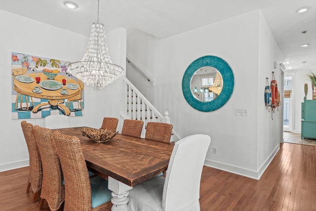97 Red Cedar Way, Santa Rosa Beach, FL 32459 - dining room featuring a chandelier, wood finished floors, stairs, and recessed lighting