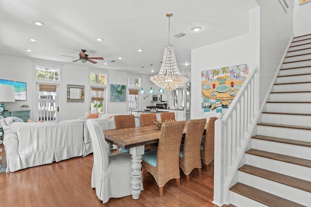 97 Red Cedar Way, Santa Rosa Beach, FL 32459 - dining space with stairs, recessed lighting, light wood finished floors, ceiling fan, and a chandelier