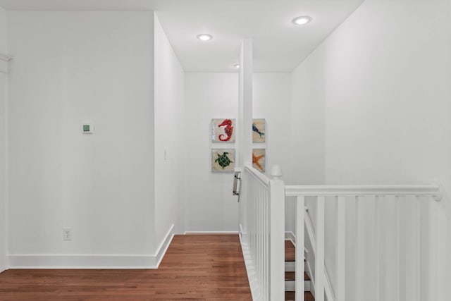 97 Red Cedar Way, Santa Rosa Beach, FL 32459 - hall with an upstairs landing, wood finished floors, and recessed lighting