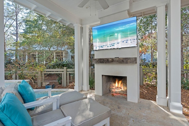 97 Red Cedar Way, Santa Rosa Beach, FL 32459 - view of patio / terrace featuring a warm lit fireplace and a ceiling fan