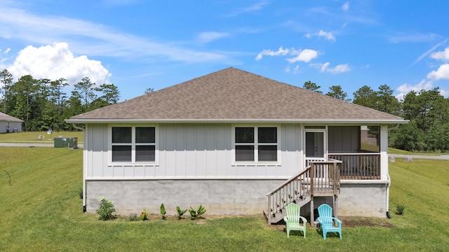 6721 Sarah Ann Way, Laurel Hill, FL 32567 - view of front of property featuring roof with shingles, a front yard, and board and batten siding