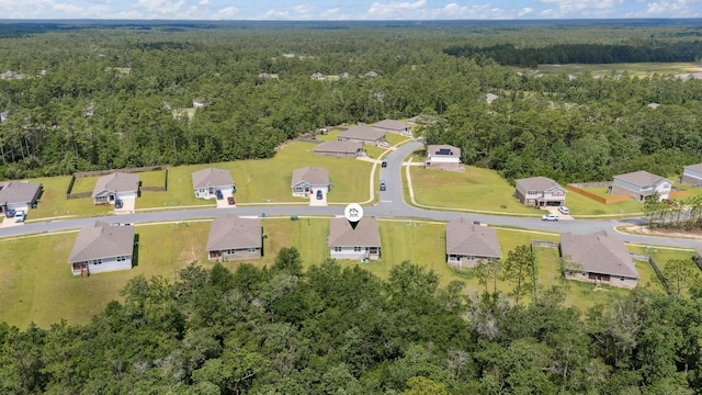 6721 Sarah Ann Way, Laurel Hill, FL 32567 - aerial view of property and surrounding area featuring a forest and nearby suburban area