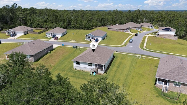 6721 Sarah Ann Way, Laurel Hill, FL 32567 - aerial perspective of suburban area featuring a heavily wooded area