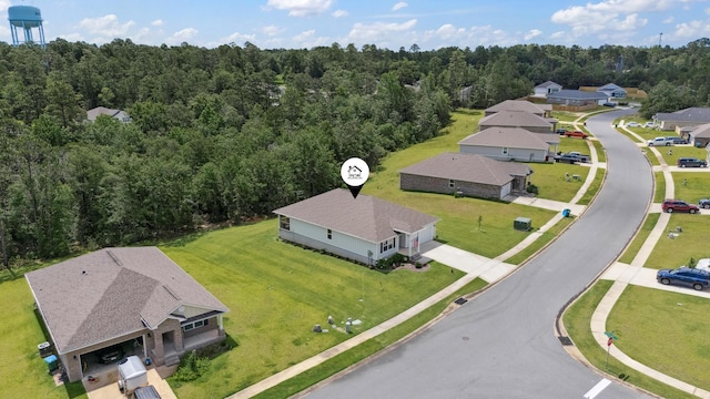 6721 Sarah Ann Way, Laurel Hill, FL 32567 - aerial view of residential area featuring a forest