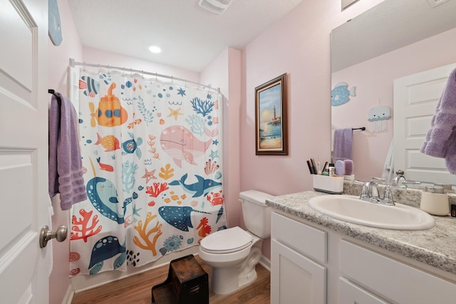 6721 Sarah Ann Way, Laurel Hill, FL 32567 - bathroom with wood finished floors, vanity, and a shower with curtain