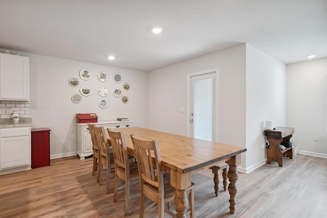 6721 Sarah Ann Way, Laurel Hill, FL 32567 - dining area featuring light wood-style floors, recessed lighting, and a textured ceiling