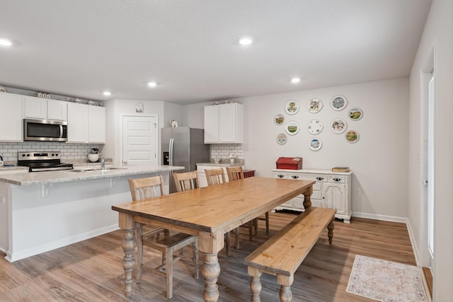 6721 Sarah Ann Way, Laurel Hill, FL 32567 - dining area featuring light wood-style flooring and recessed lighting