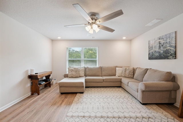 6721 Sarah Ann Way, Laurel Hill, FL 32567 - living room featuring light wood-type flooring, a ceiling fan, recessed lighting, and a textured ceiling