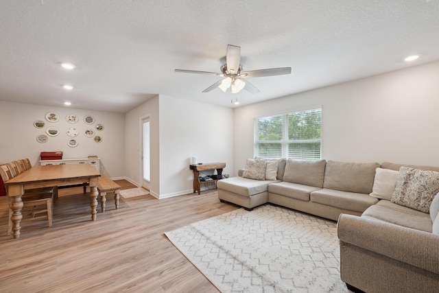 6721 Sarah Ann Way, Laurel Hill, FL 32567 - living room with light wood-style flooring, recessed lighting, a ceiling fan, and a textured ceiling
