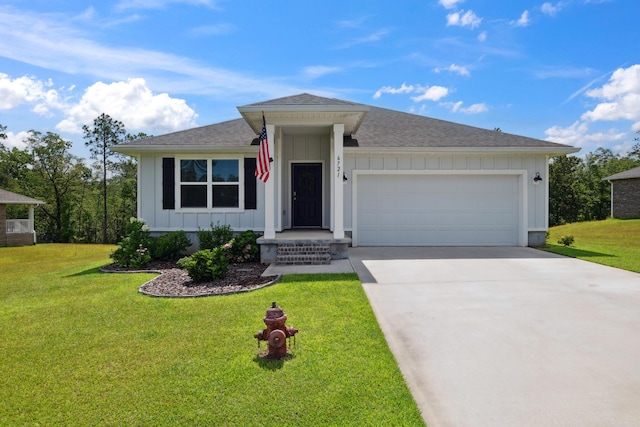 6721 Sarah Ann Way, Laurel Hill, FL 32567 - view of front of property featuring board and batten siding, a garage, driveway, a shingled roof, and a front yard
