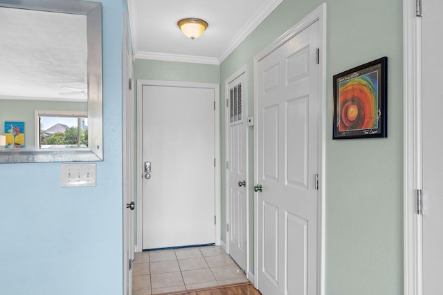 445 Gulf Shore Dr Unit 206, Destin, FL 32541 - hallway featuring crown molding and light tile patterned floors