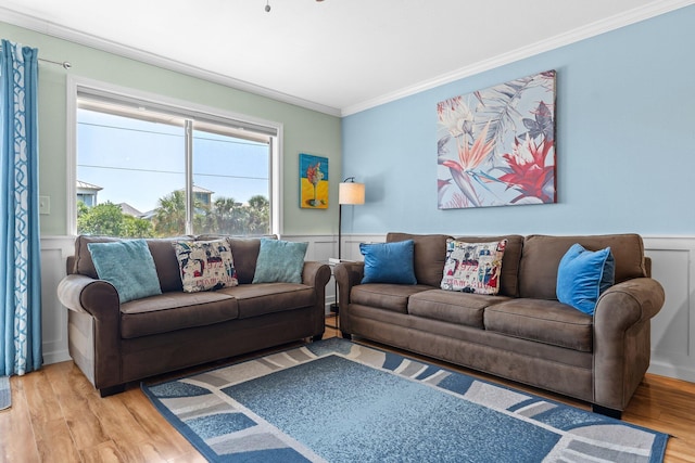 445 Gulf Shore Dr Unit 206, Destin, FL 32541 - living room with wood finished floors, ornamental molding, wainscoting, and a decorative wall