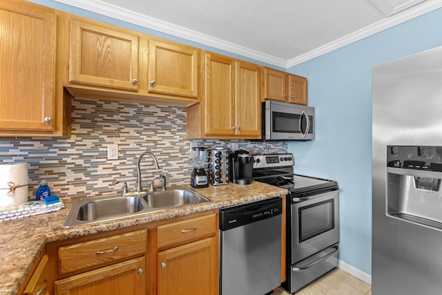 445 Gulf Shore Dr Unit 206, Destin, FL 32541 - kitchen with stainless steel appliances, ornamental molding, decorative backsplash, light tile patterned floors, and light countertops