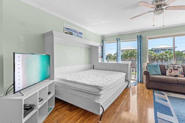 445 Gulf Shore Dr Unit 206, Destin, FL 32541 - bedroom with crown molding, access to outside, wood finished floors, and multiple windows