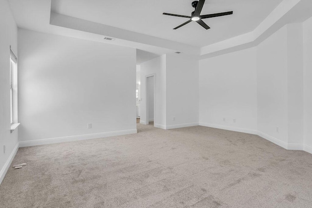 1005 Shalimar Point Dr, Shalimar, FL 32579 - carpeted spare room with a raised ceiling and ceiling fan
