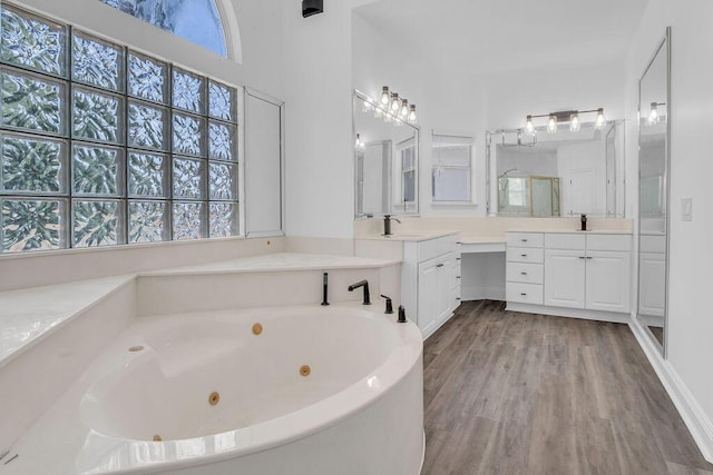 1005 Shalimar Point Dr, Shalimar, FL 32579 - full bathroom with a whirlpool tub, wood finished floors, vanity, and a stall shower