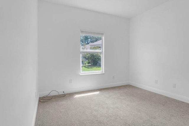 1005 Shalimar Point Dr, Shalimar, FL 32579 - spare room featuring carpet floors and baseboards