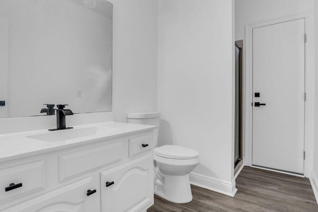 1005 Shalimar Point Dr, Shalimar, FL 32579 - bathroom featuring a shower stall, wood finished floors, and vanity