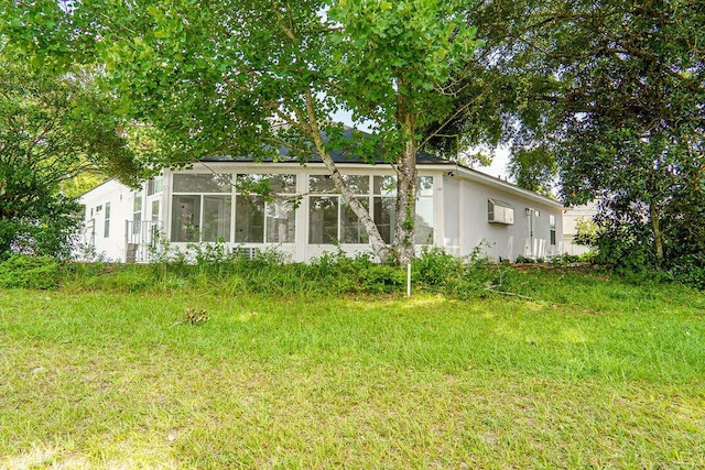1005 Shalimar Point Dr, Shalimar, FL 32579 - back of house with a sunroom and stucco siding