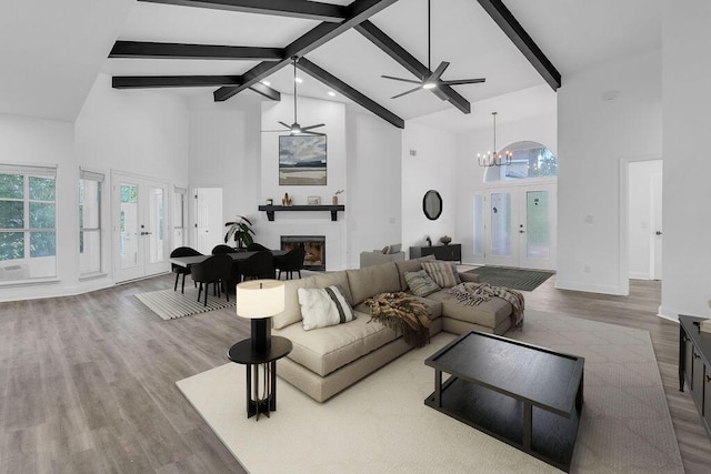 1005 Shalimar Point Dr, Shalimar, FL 32579 - living area with high vaulted ceiling, french doors, ceiling fan, wood finished floors, and beam ceiling