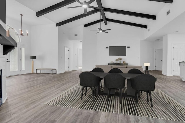 1005 Shalimar Point Dr, Shalimar, FL 32579 - dining room with a ceiling fan, high vaulted ceiling, a chandelier, beam ceiling, and wood finished floors