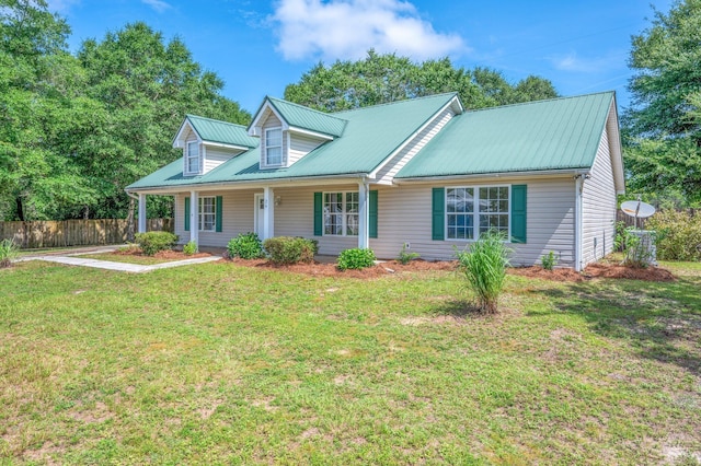 24 W Violet Ln, Defuniak Springs, FL 32433 - view of front of home with a metal roof and a porch