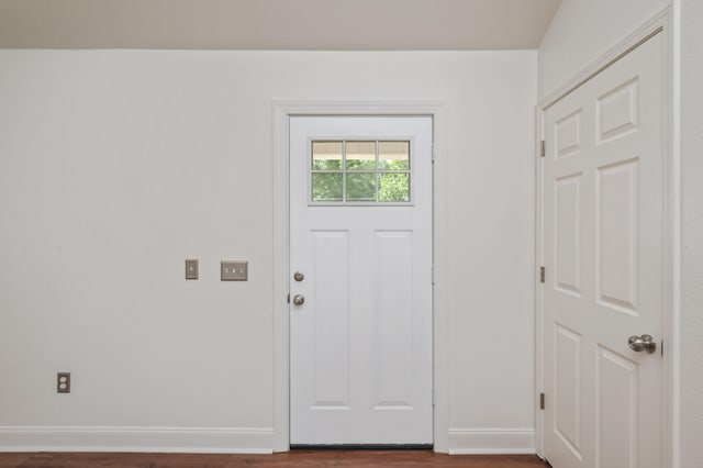 24 W Violet Ln, Defuniak Springs, FL 32433 - entryway with dark wood-style flooring and baseboards