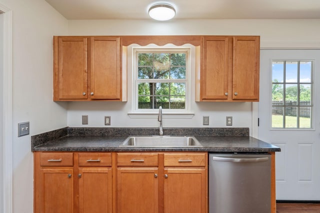 24 W Violet Ln, Defuniak Springs, FL 32433 - kitchen with dishwasher, dark countertops, and brown cabinetry