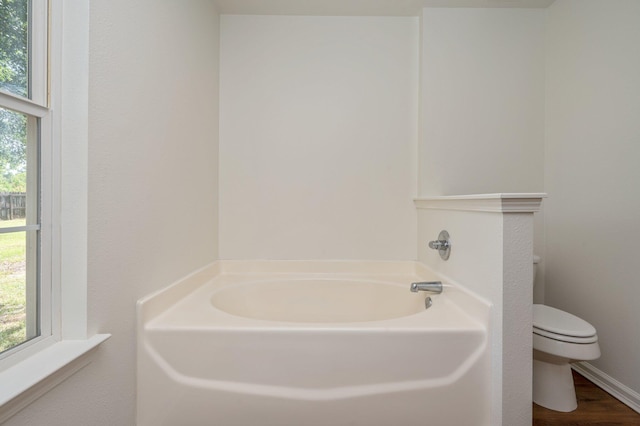 24 W Violet Ln, Defuniak Springs, FL 32433 - full bathroom with a garden tub and wood finished floors
