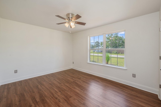 24 W Violet Ln, Defuniak Springs, FL 32433 - empty room with ceiling fan and dark wood-style flooring