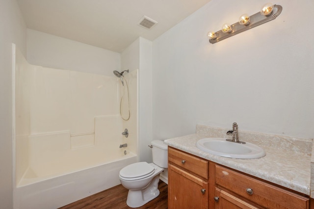 24 W Violet Ln, Defuniak Springs, FL 32433 - full bath featuring vanity, wood finished floors, and bathing tub / shower combination