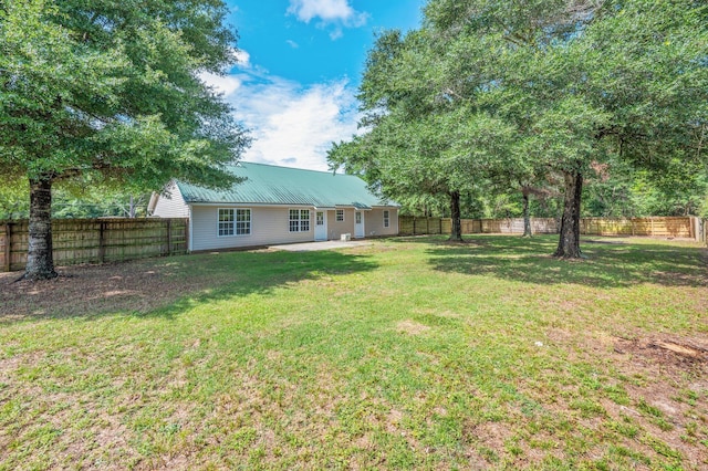 24 W Violet Ln, Defuniak Springs, FL 32433 - fenced backyard with a patio