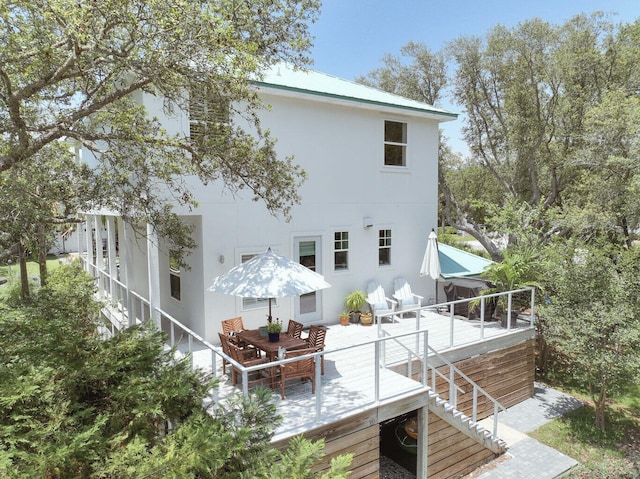 192 Lake Pointe Dr, Santa Rosa Beach, FL 32459 - back of house with a wooden deck, stairway, and outdoor dining space