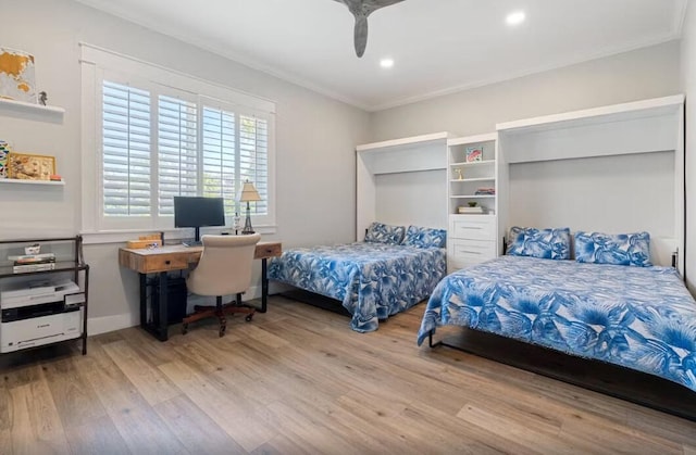 192 Lake Pointe Dr, Santa Rosa Beach, FL 32459 - bedroom with crown molding, wood finished floors, recessed lighting, ceiling fan, and an office area