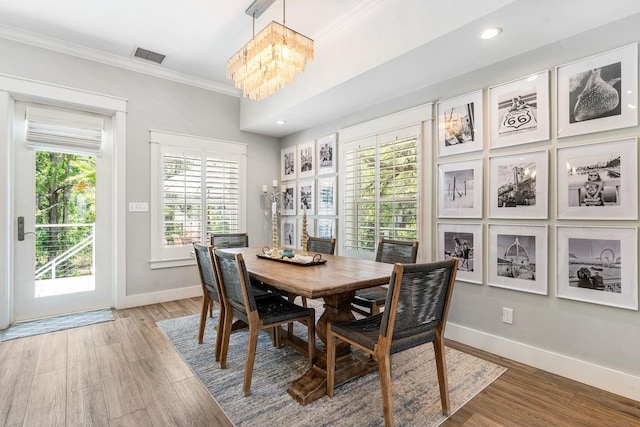 192 Lake Pointe Dr, Santa Rosa Beach, FL 32459 - dining space with a chandelier, crown molding, light wood-type flooring, and recessed lighting