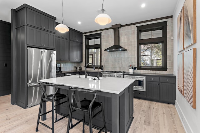 395 Tumblehome Way, Santa Rosa Beach, FL 32459 - kitchen with appliances with stainless steel finishes, wall chimney exhaust hood, backsplash, healthy amount of natural light, and recessed lighting