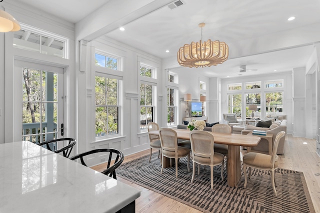 395 Tumblehome Way, Santa Rosa Beach, FL 32459 - dining space with a decorative wall, light wood finished floors, plenty of natural light, a chandelier, and recessed lighting